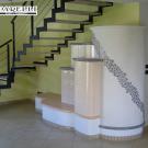 Stufa ad olle in maiolica e muratura, con mosaico in ceramica (cod. 91).