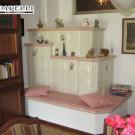 Stufa in maiolica con panca (cod.45).